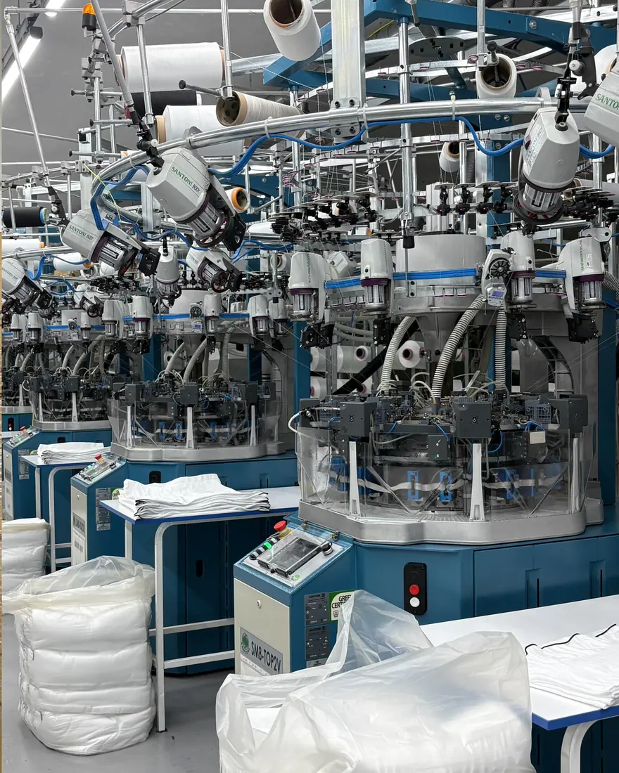 Santoni Top2V seamless circular knitting machine running on the Overfit Seamless knitting floor
